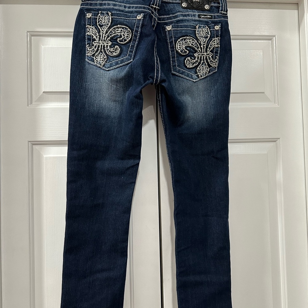 Miss me jeans.  Signature rise, straight leg.